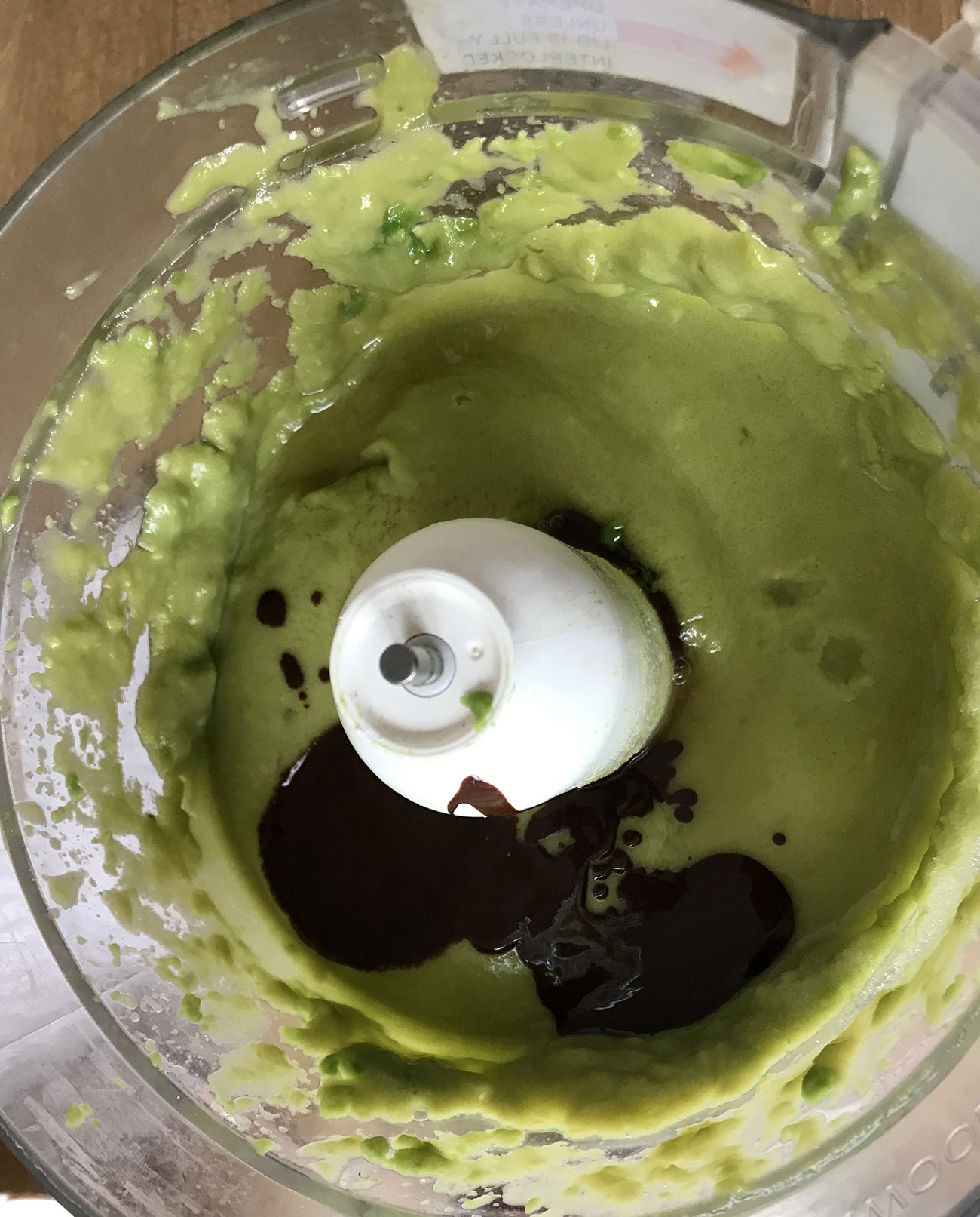 Add the melted chocolate mixture to the avocado mixture and keep mixing.