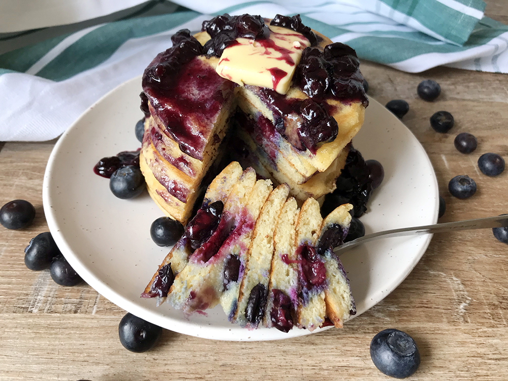 Keto Blueberry Pancakes and lots of fresh blueberries around.