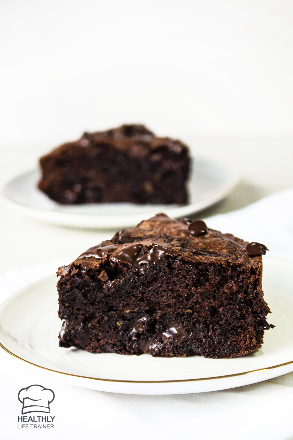 A rich and healthy chocolate zucchini cake topped with dark chocolate to self indulge after a rough day. 