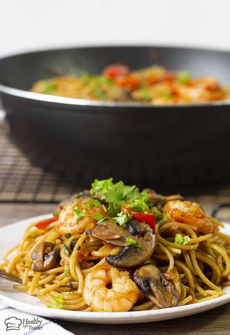 Chinese style shrimp pasta cooked in a flavourful sauce. This sauce has fresh ginger, sesame oil, garlic, soy sauce and brown sugar. 