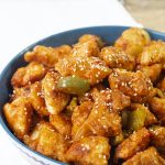 Chinese-style crispy sweet and sour chicken recipe is a crispy light fried chicken simmered in a well-balanced fragranced sticky sauce along with crunchy vegetable chunks.