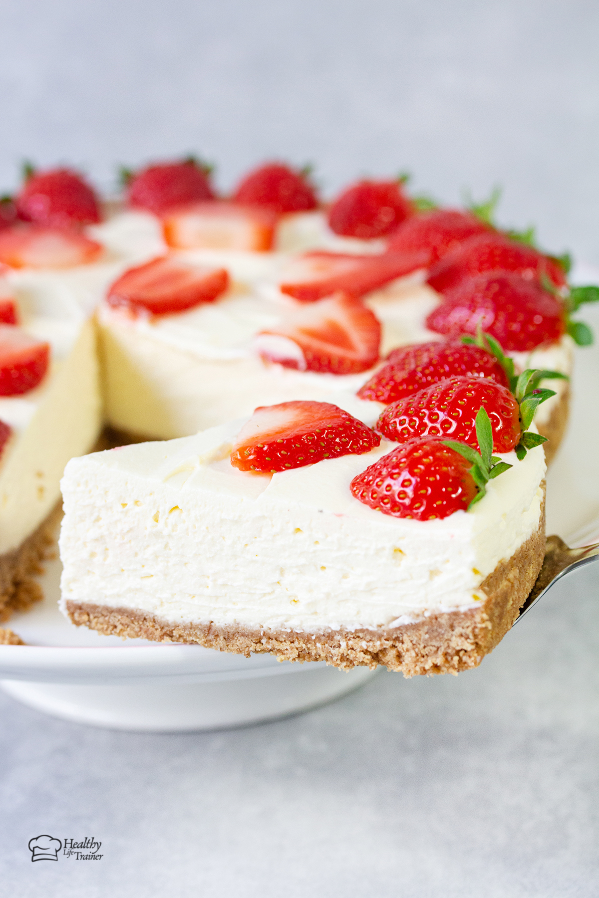 a slice of philadelphia no-bake cheesecake topped with strawberries.