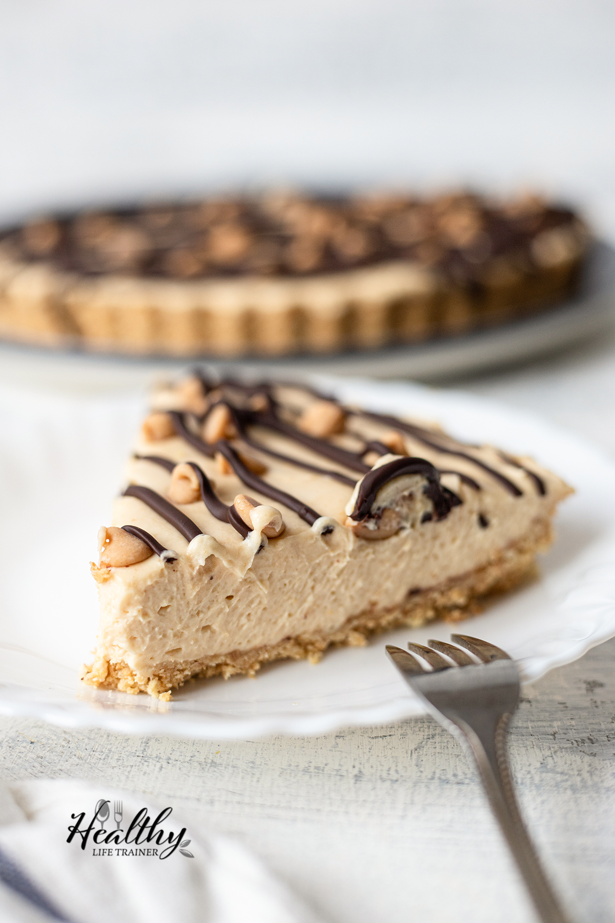 a slice of the no-bake Peanut Butter Pie in a plate.