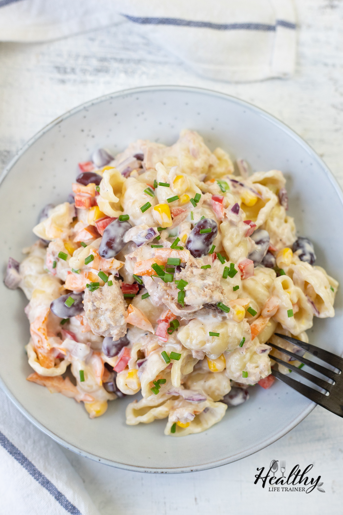 Creamy Tuna Pasta Salad with caned tuna in a plate