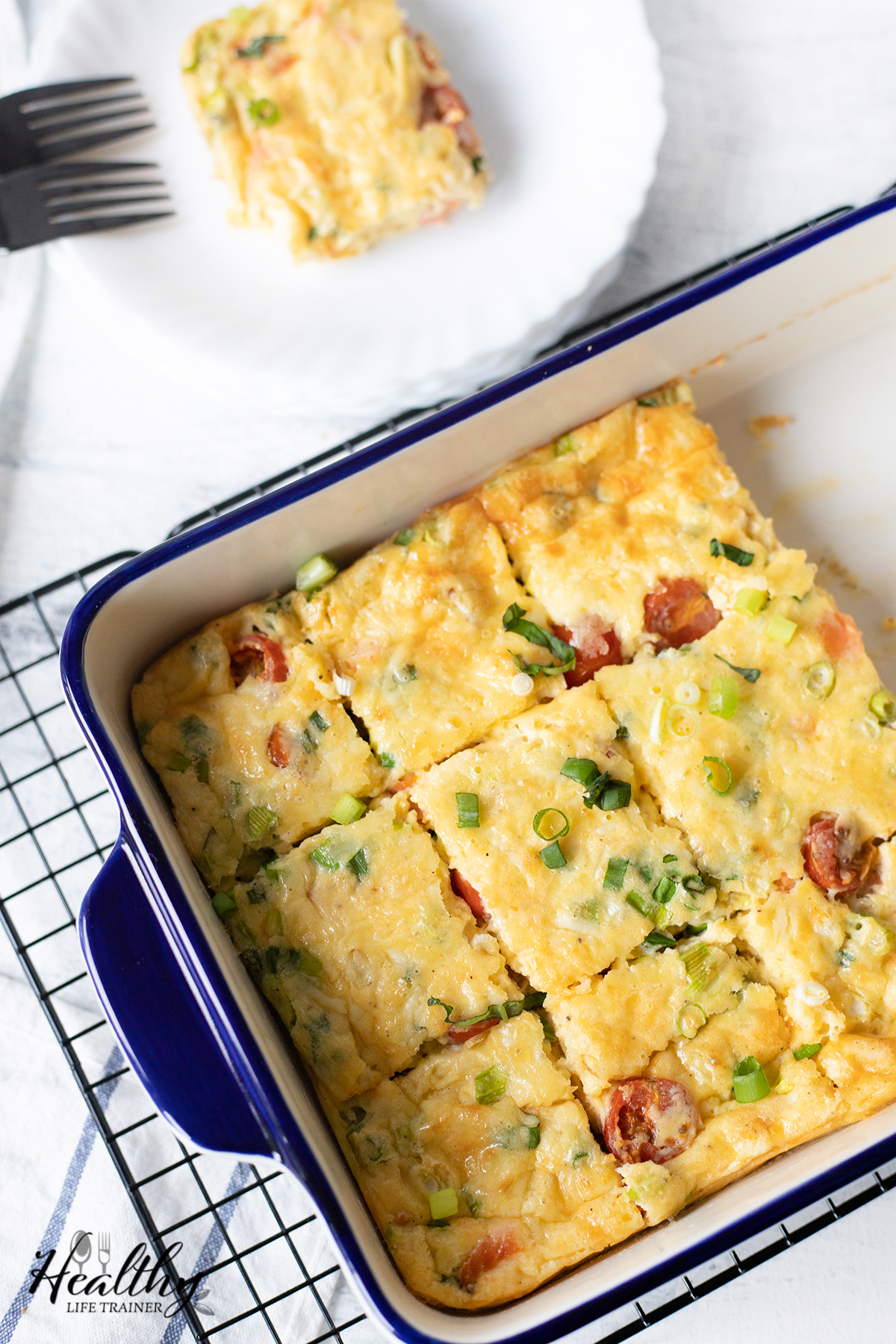 Crustless smoked salmon quiche in a baking dish.