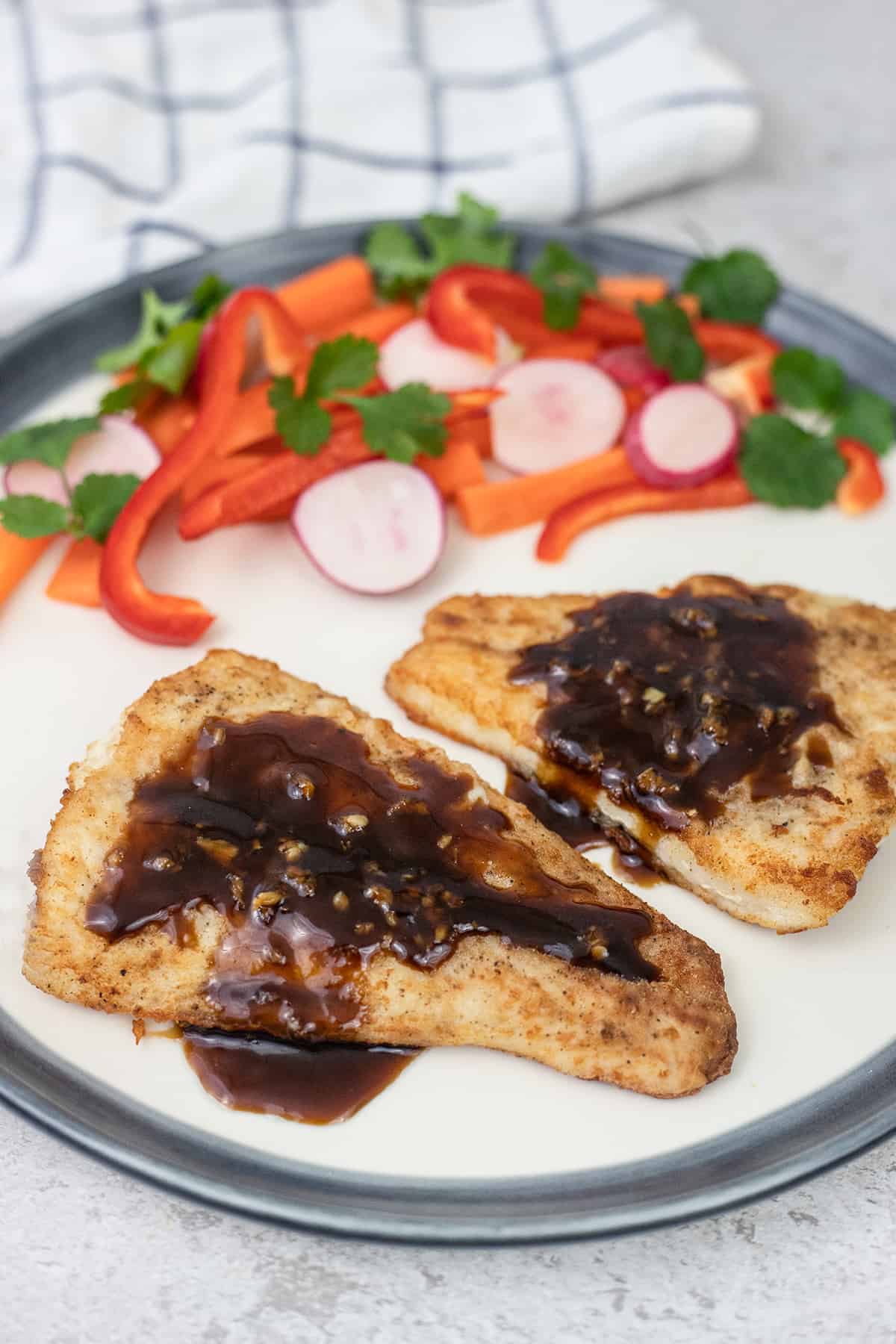 Sea bass fillets with soy sauce.