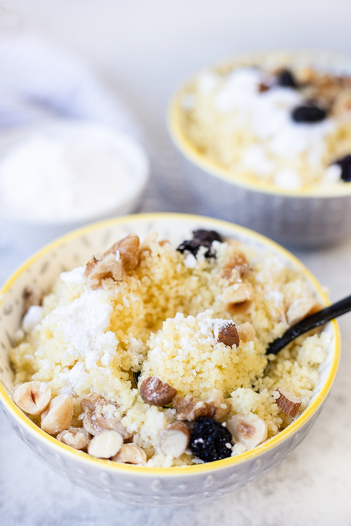 Sweet Couscous with butter, nuts, and powdered sugar