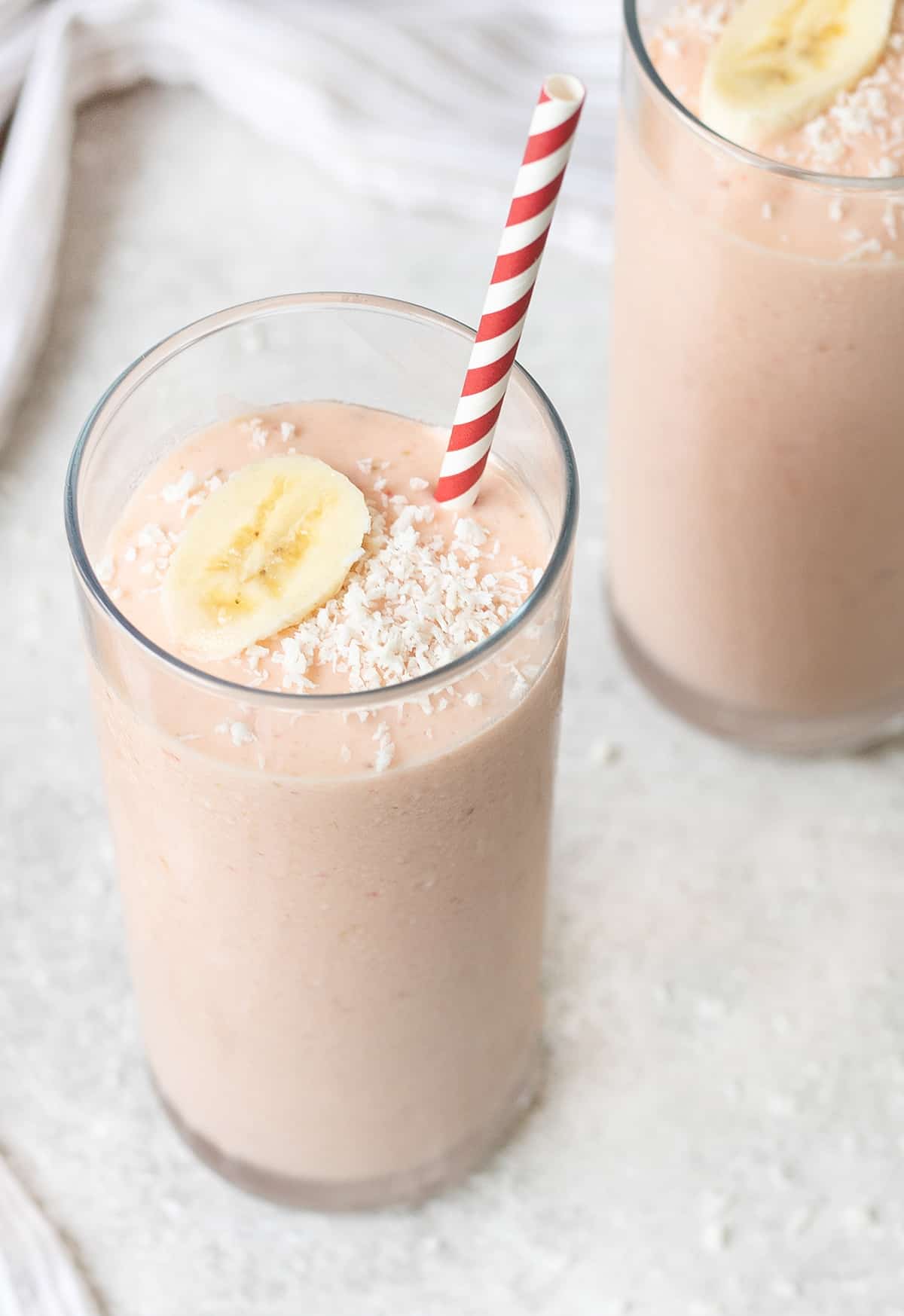 Greek Yogurt Smoothie topped with fresh banana slice.