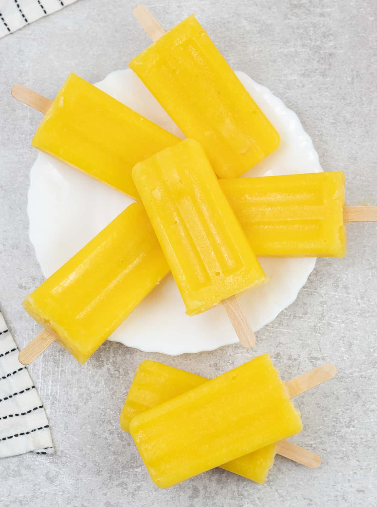 7 Mango Popsicles in a plate.