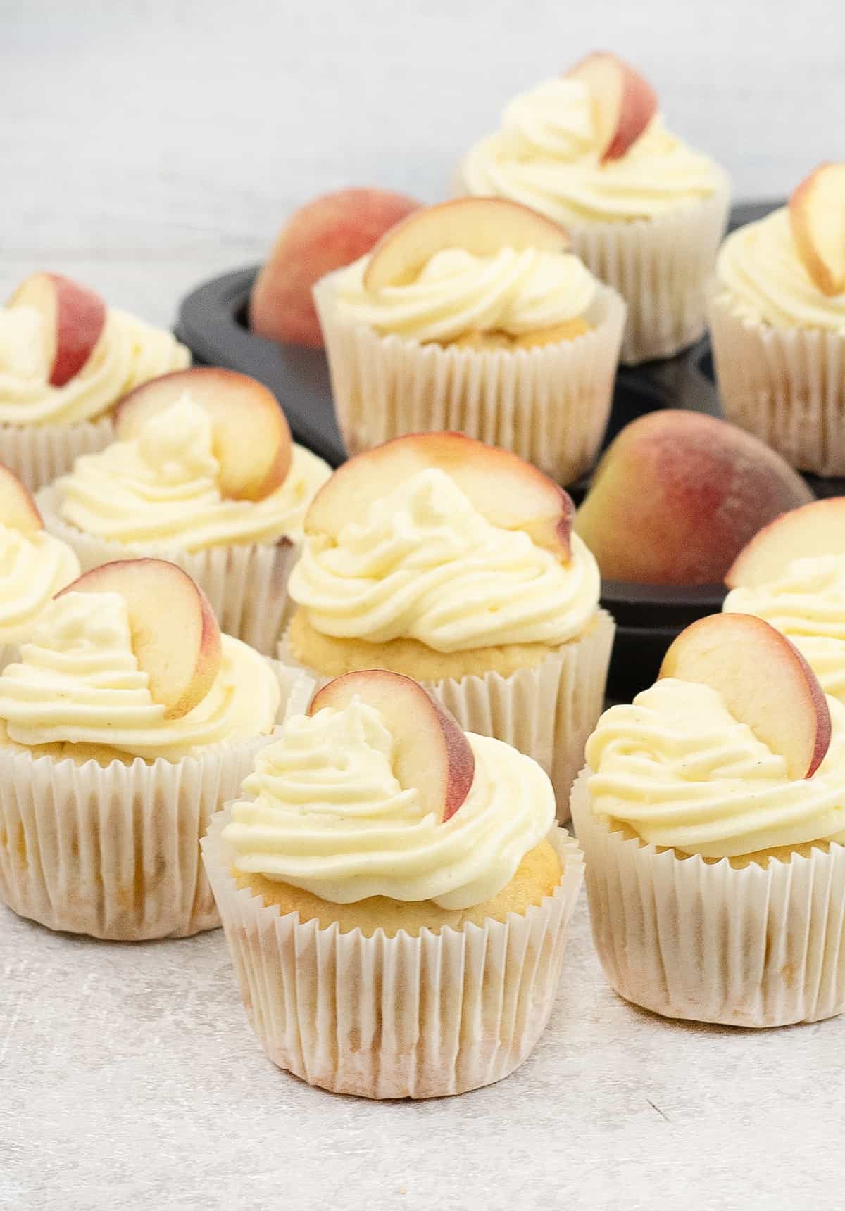 Peach Cupcakes topped wit fresh peach slice
