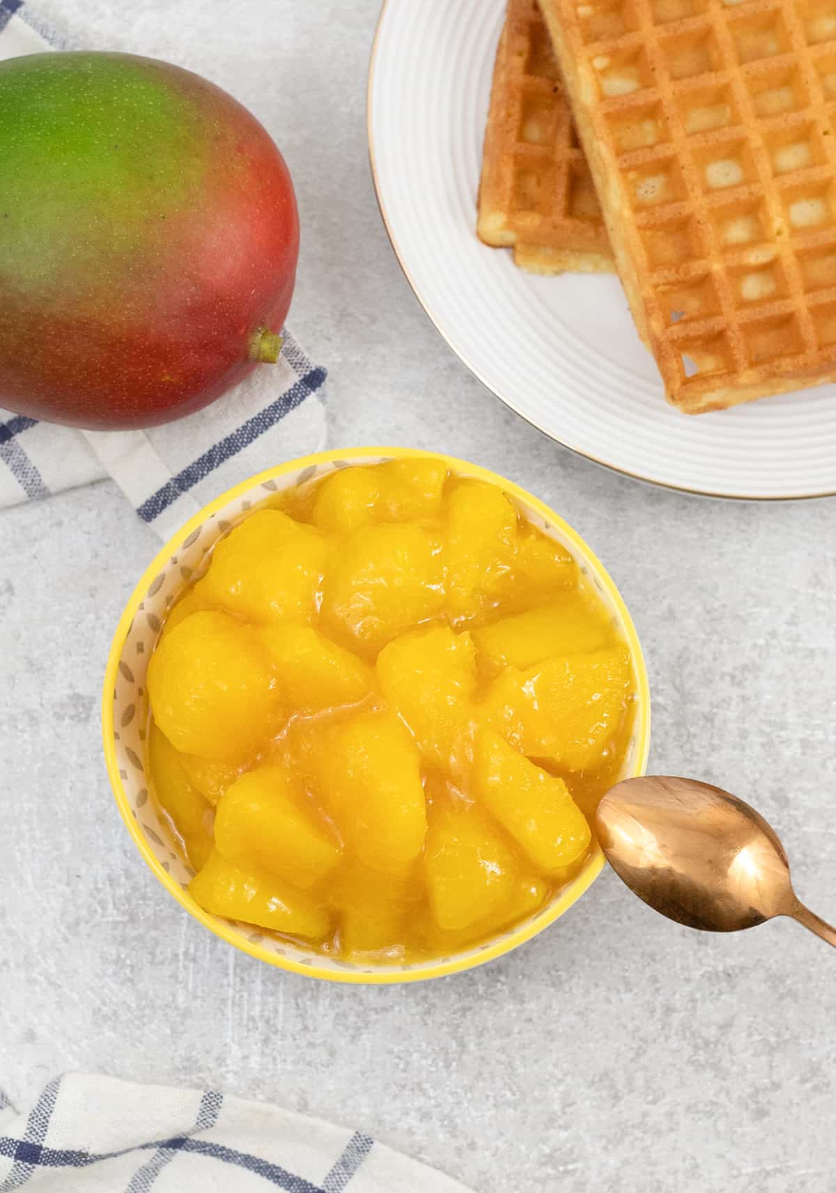 Mango Compote in a bowl and waffles