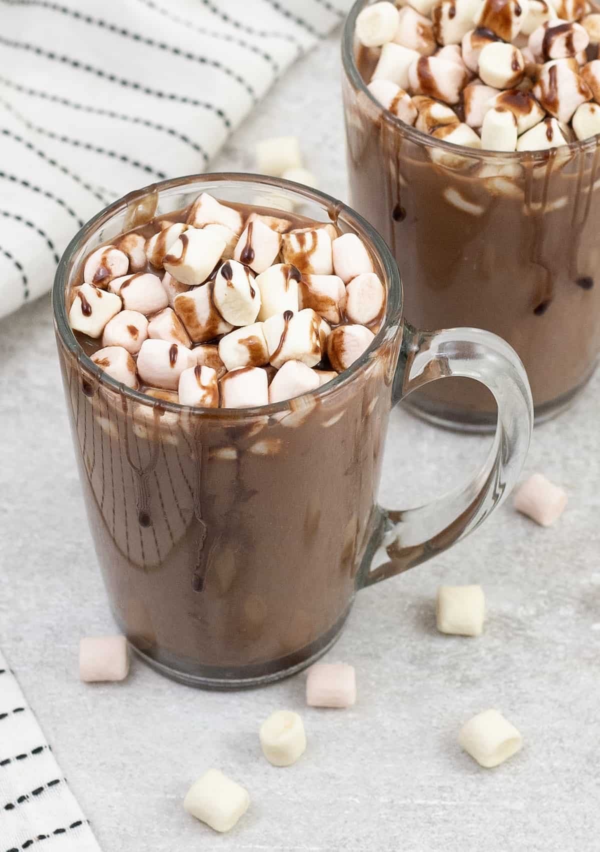 A big cup of oat milk hot chocolate topped with marshmallows.