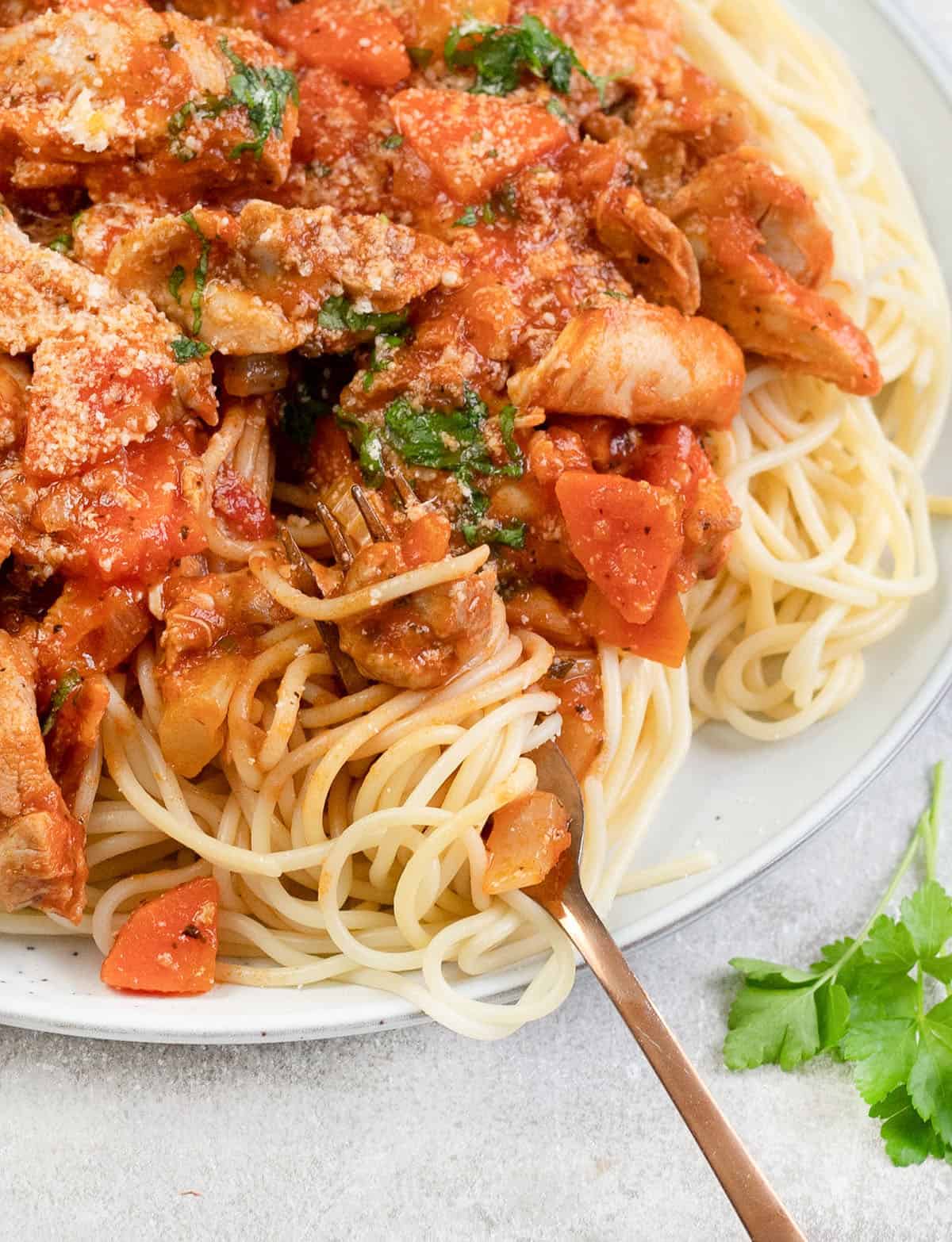 a swirl of the pasta with Chicken Bolognese.