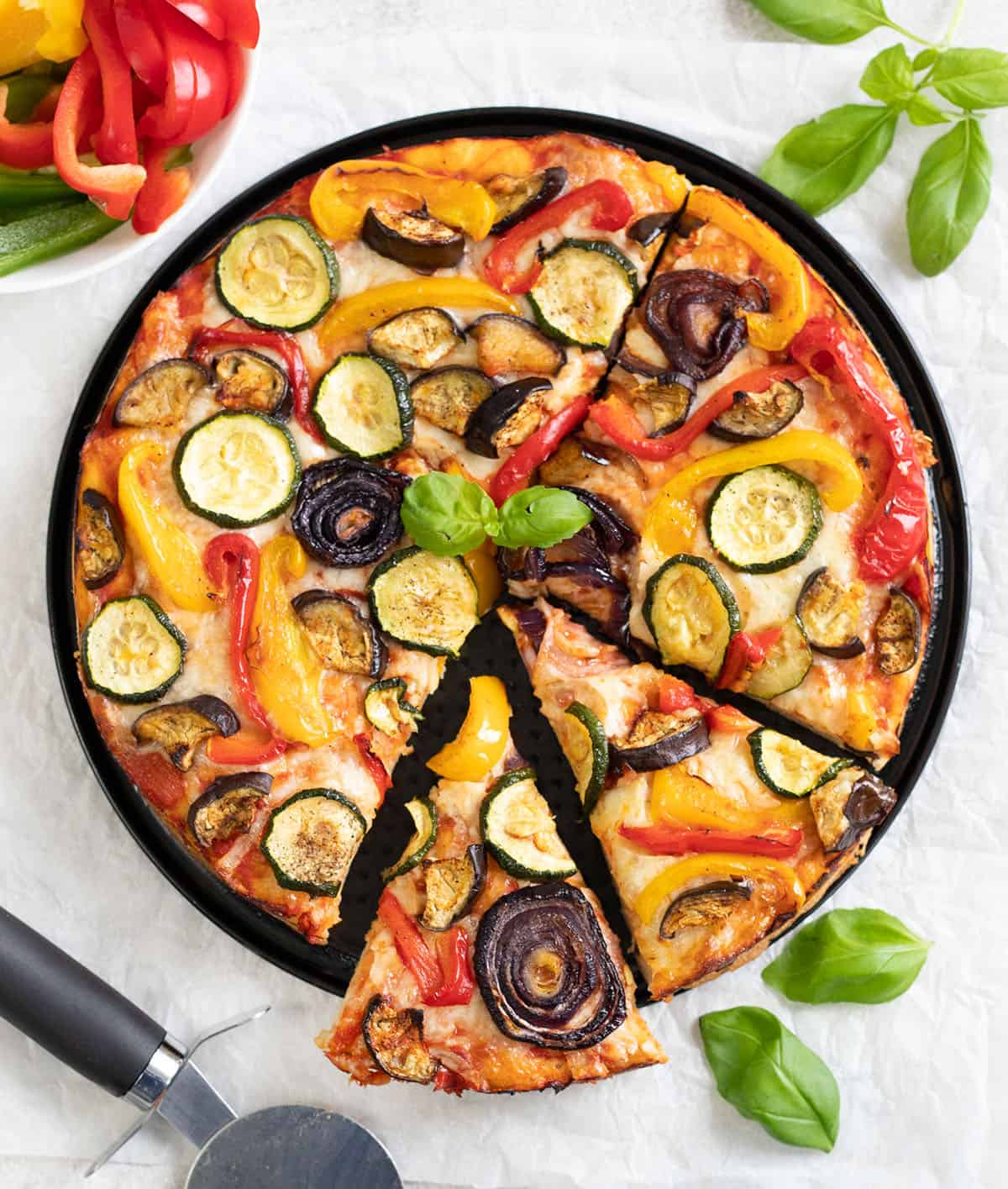 Roasted Vegetable Pizza topped with roasted veggies, cheese and pizza sauce.