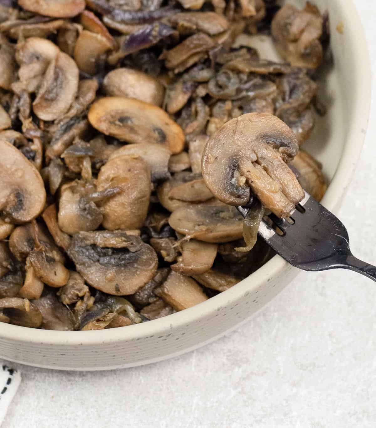 A spoonful of caramelized mushrooms and onions.