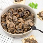 Caramelized mushrooms and onions on crackers.