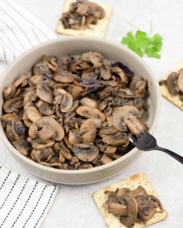 Caramelized mushrooms and onions on crackers.