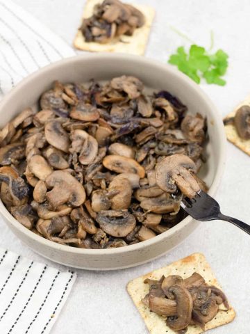 Caramelized mushrooms and onions on crackers.