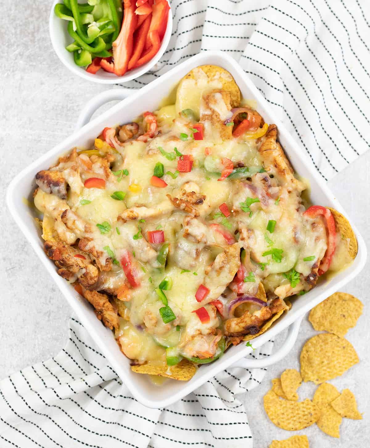 baking dish full of Chicken Fajita Nachos