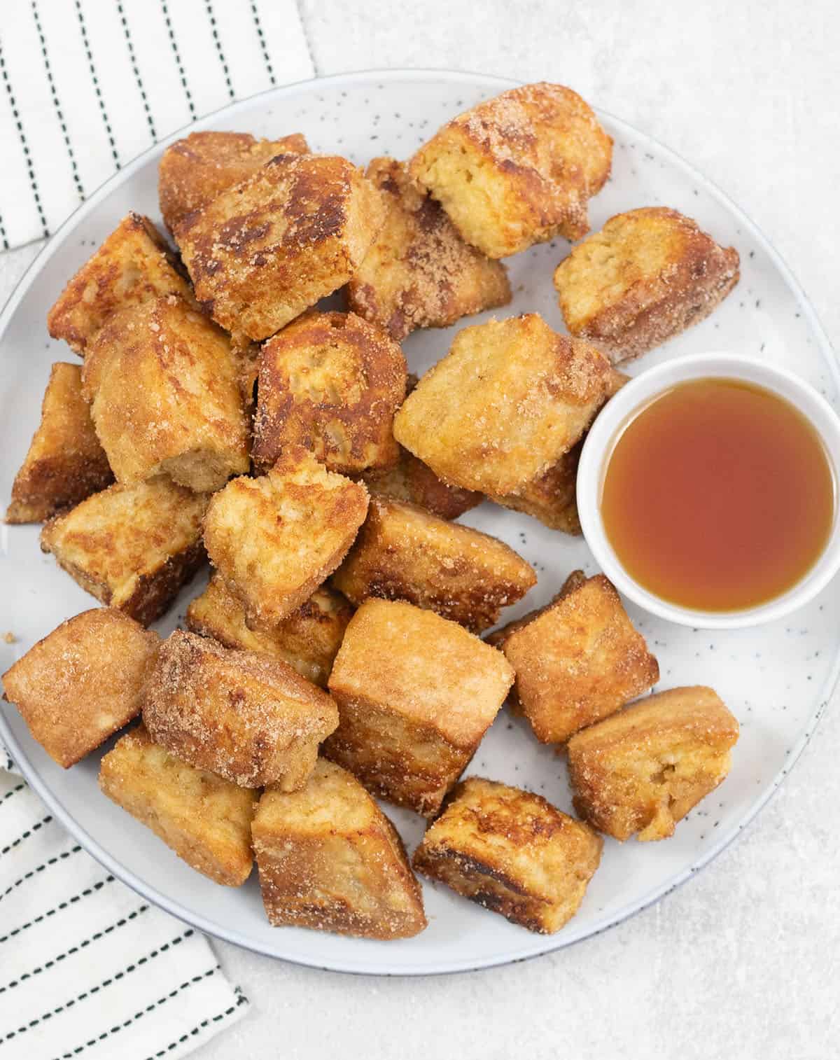 a plate full of Cinnamon French Toast Bites.