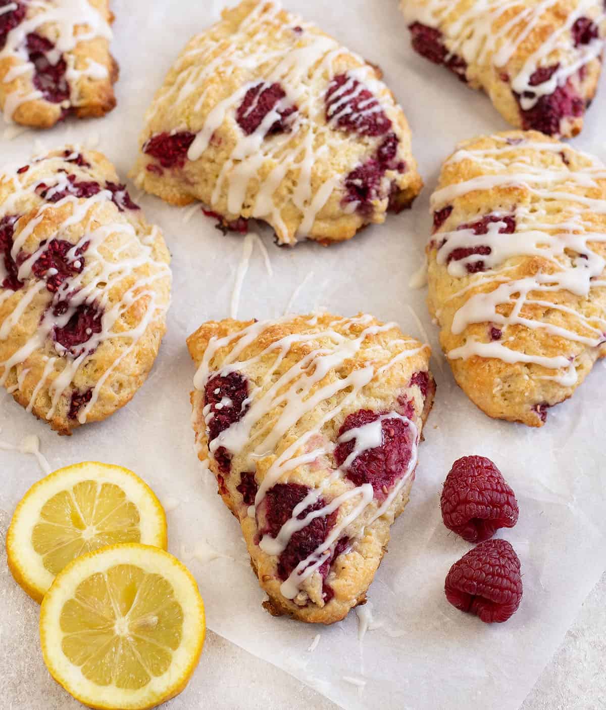 Lemon raspberry scones along with some fresh raspberries.