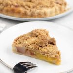 A slice of the peach mango pie in a serving plate.