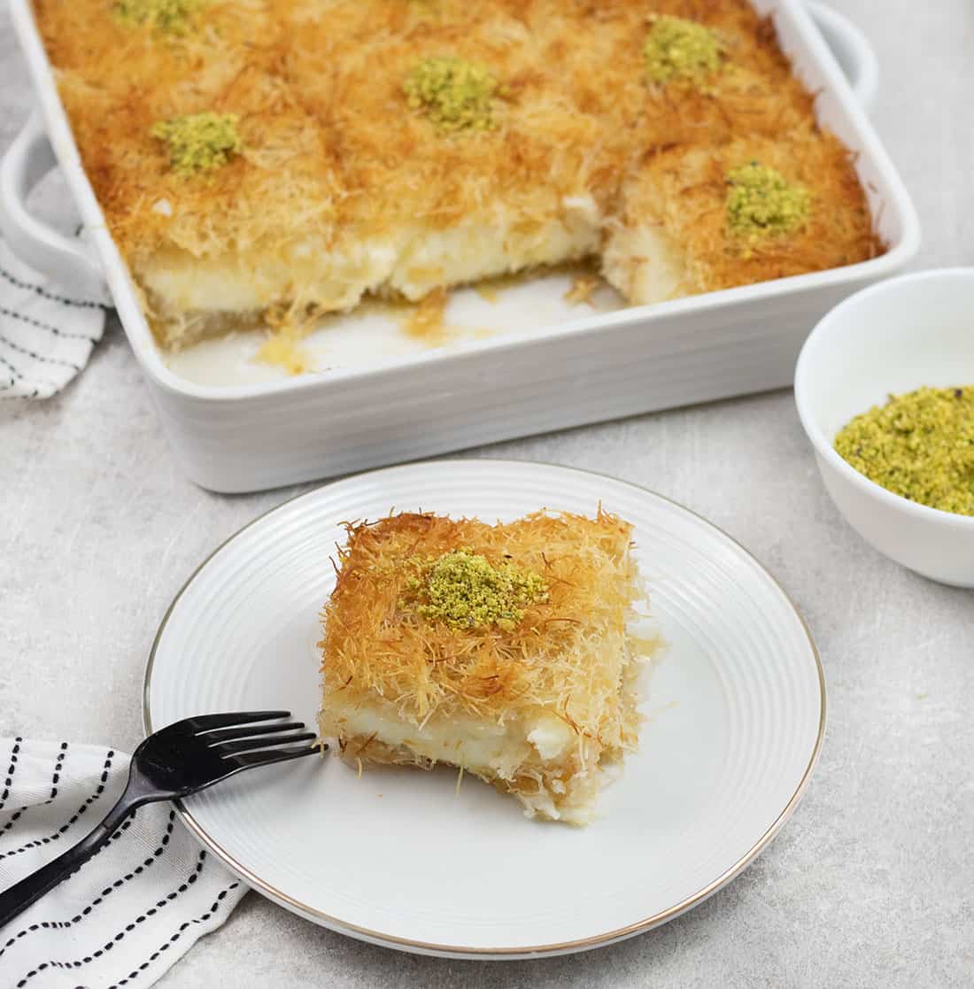 a slice of Kunafa in a serving plate