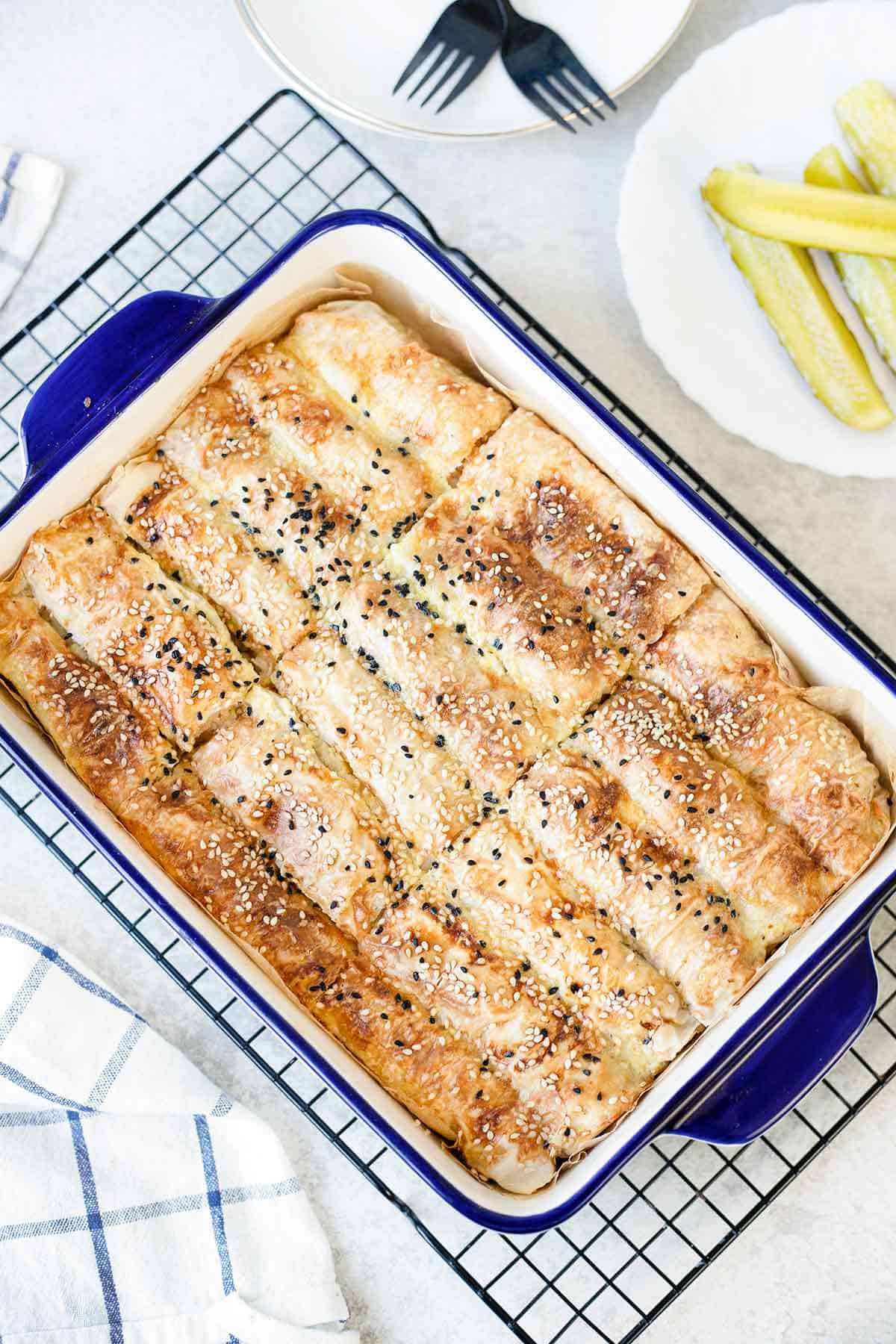 a whole baking dish filled with potato and onion rolls