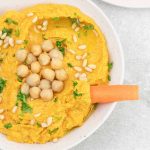 Sriracha carrot Hummus in a bowl.