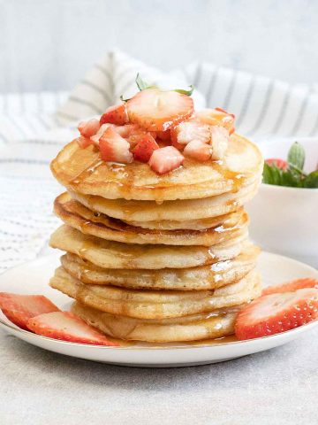 Oat Milk Pancakes and strawberries in a plate