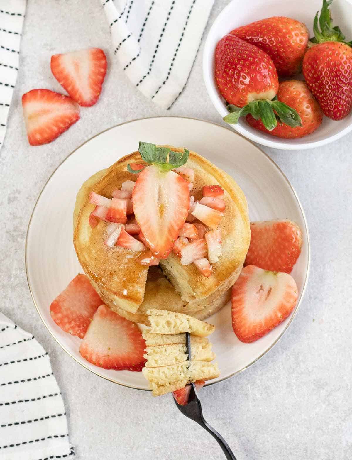 Oat Milk Pancakes and strawberries in a plate