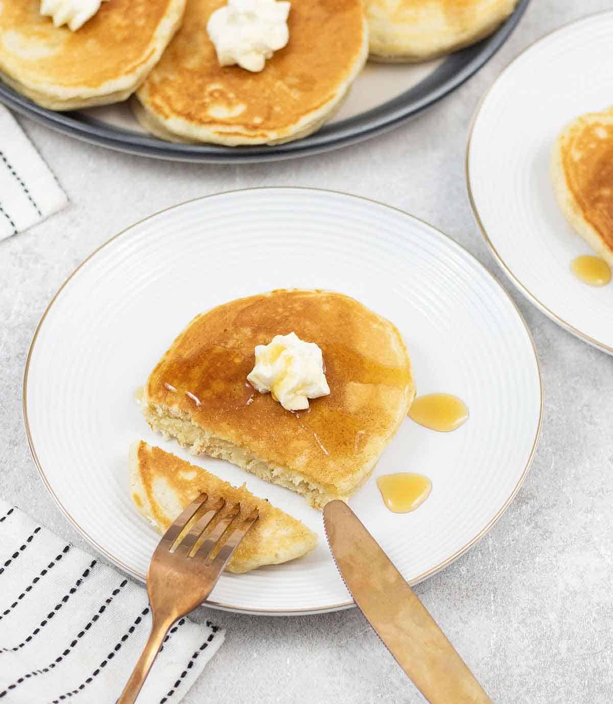 cutting a sweet cream pancake