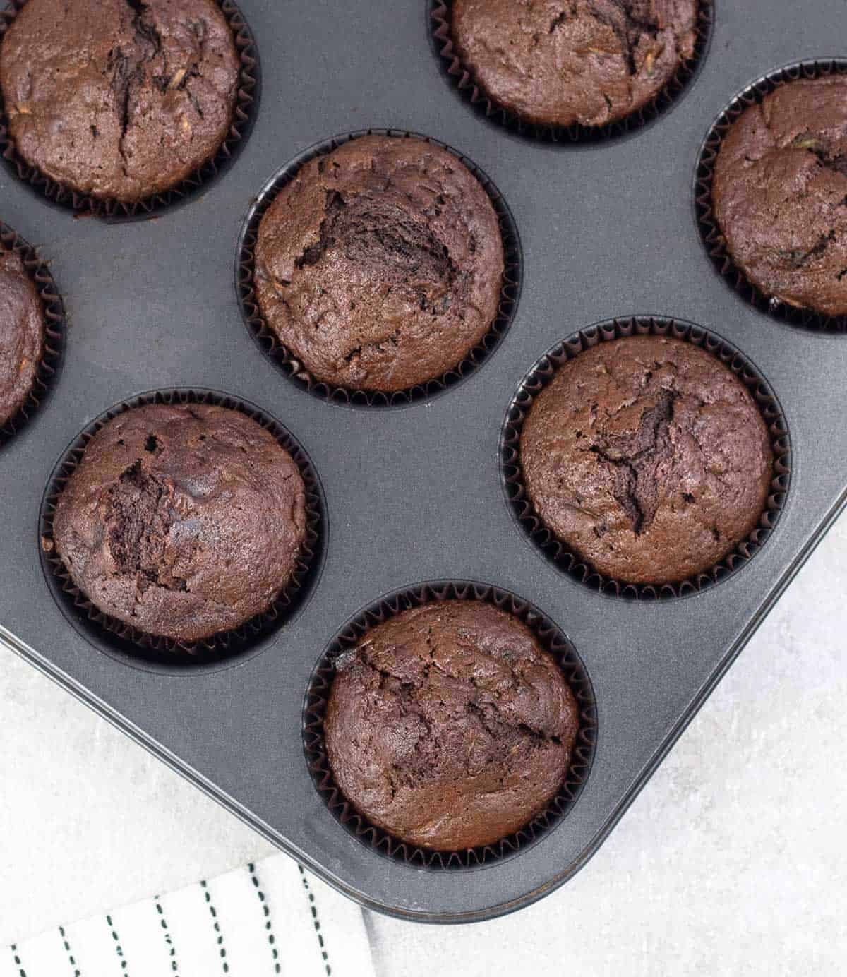 Chocolate Courgette Muffins in the muffin tin.