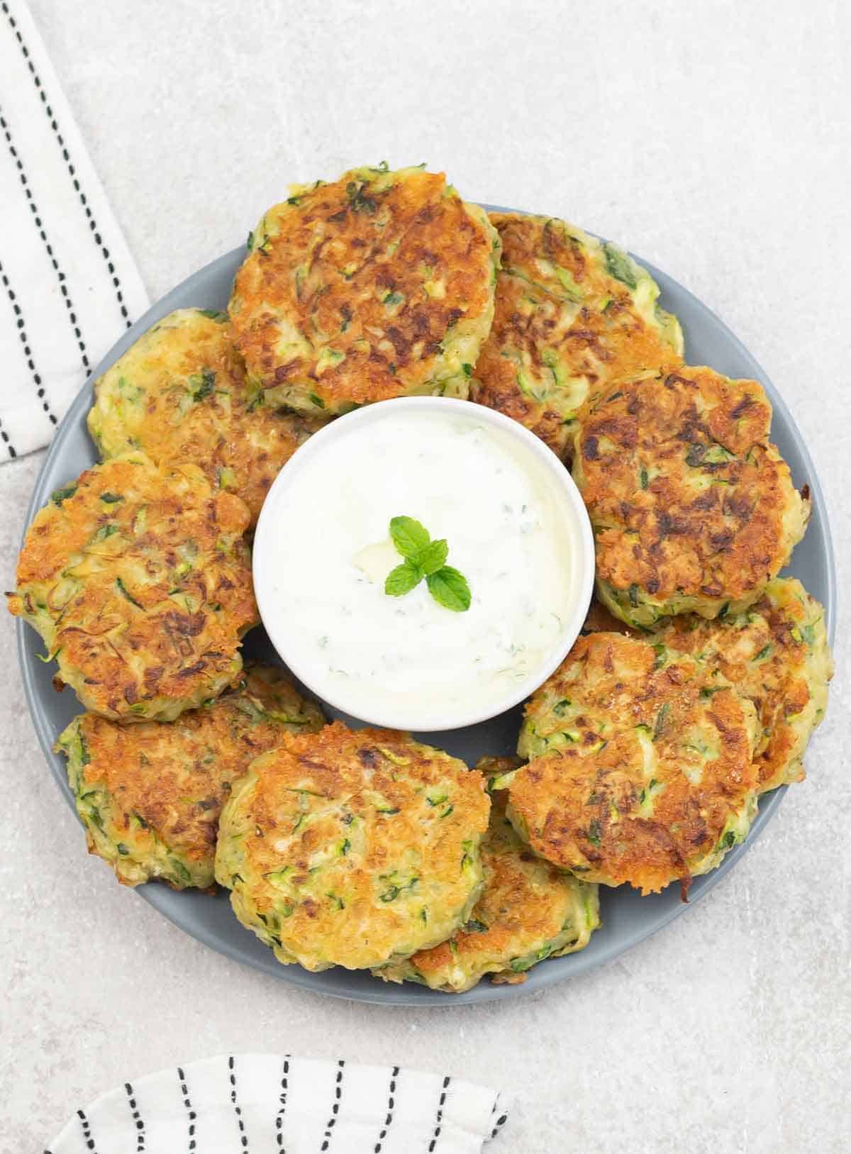 Cheesy Courgette Fritters in aa plate