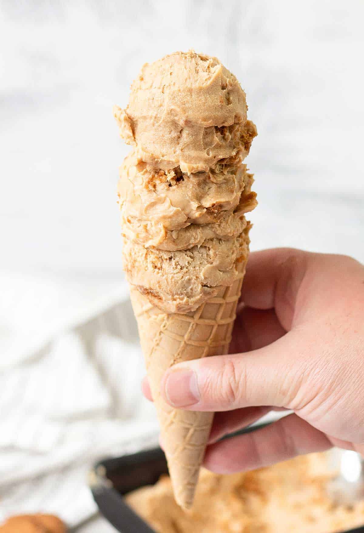 a cone topped with Biscoff Ice Cream balls.