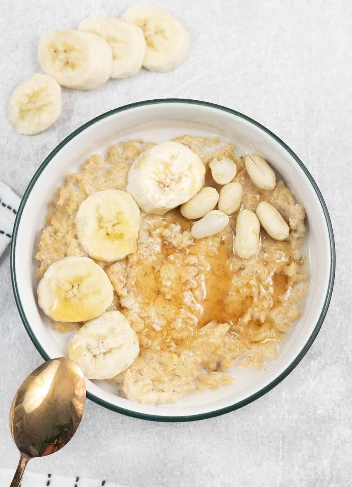 a bowl of Peanut Butter Porridge and banana slices