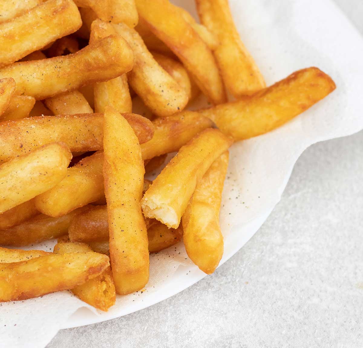 a plate full of Belgian Fries.