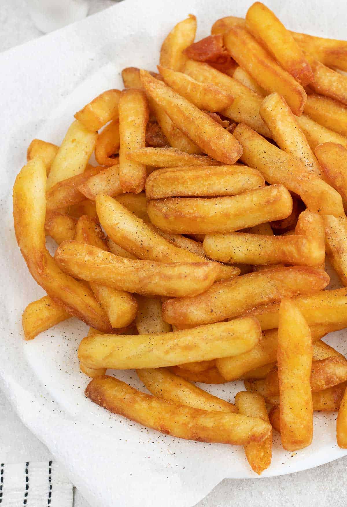 golden brown Belgian Fries in a plate.