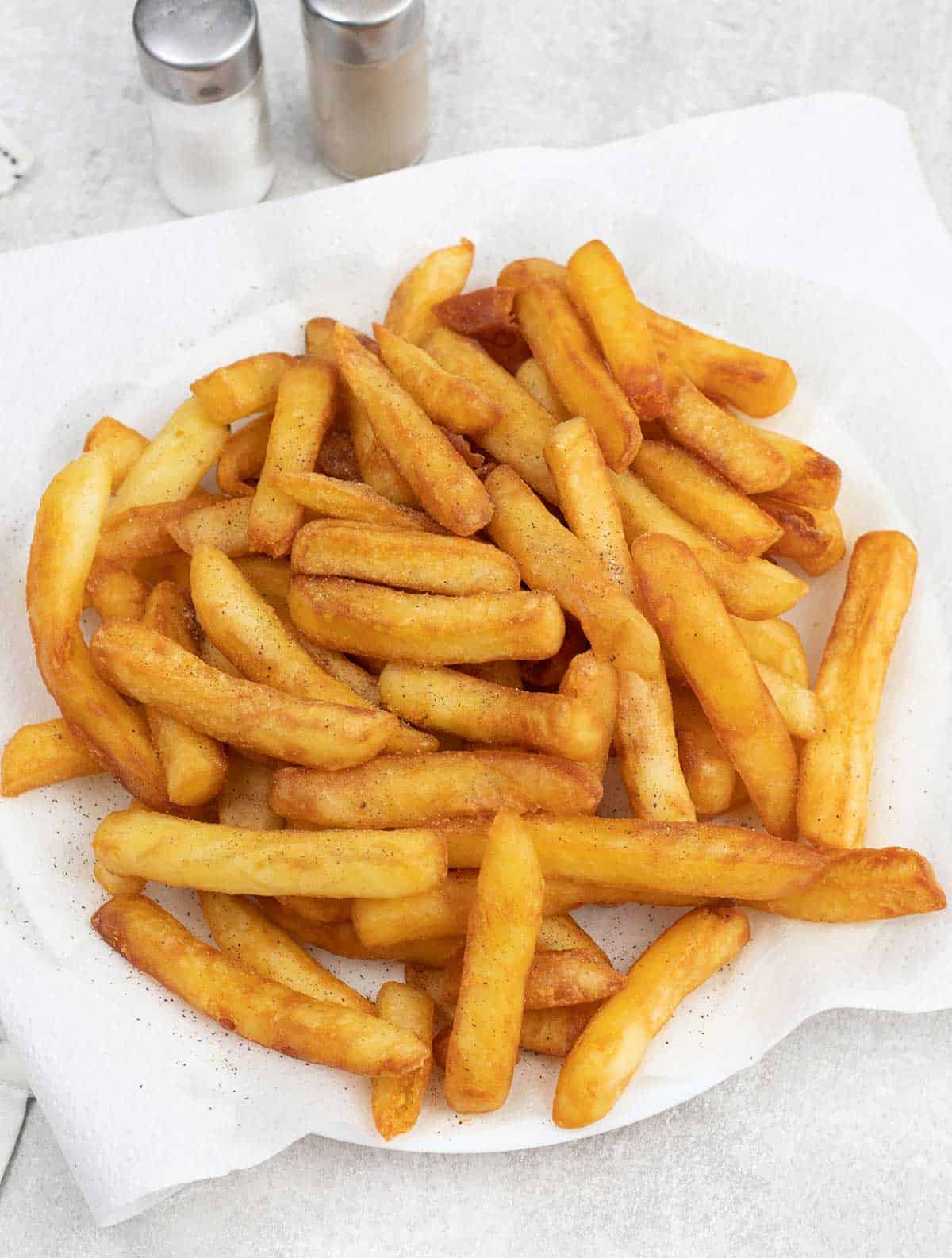 Belgian Fries topped with salt and pepper.
