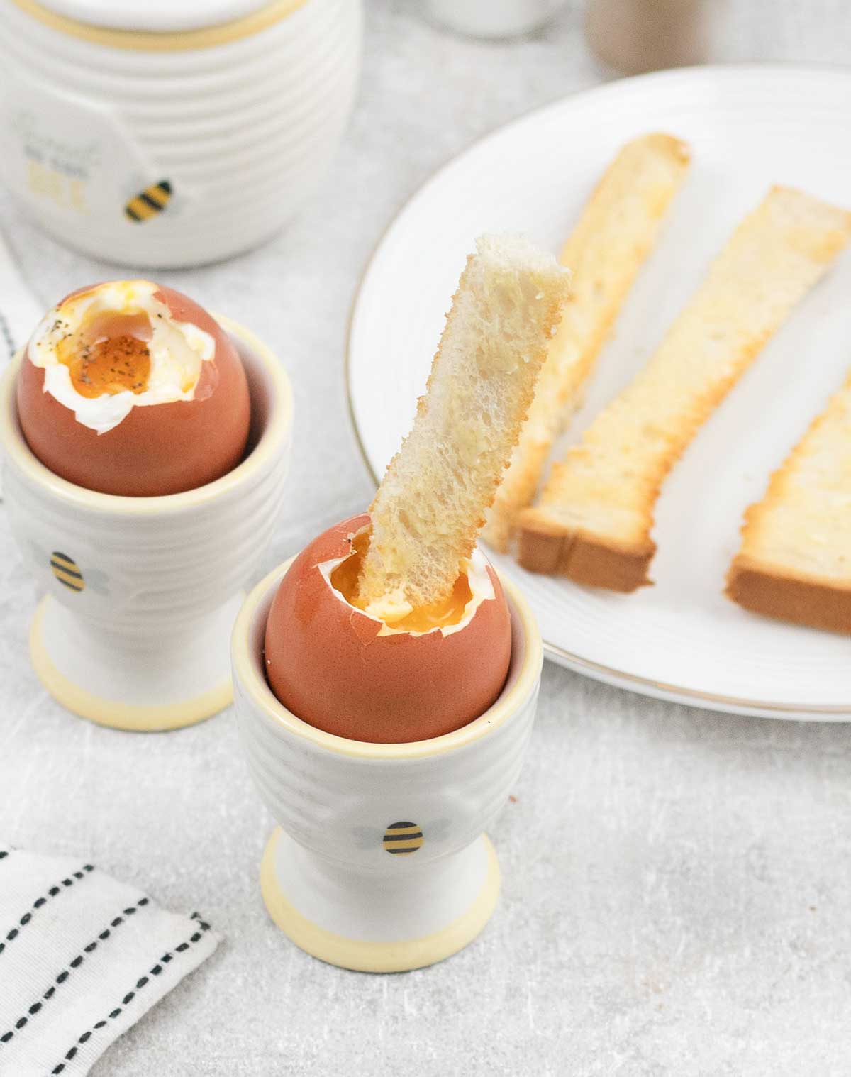 2 Dippy Eggs in egg cups with soldiers.