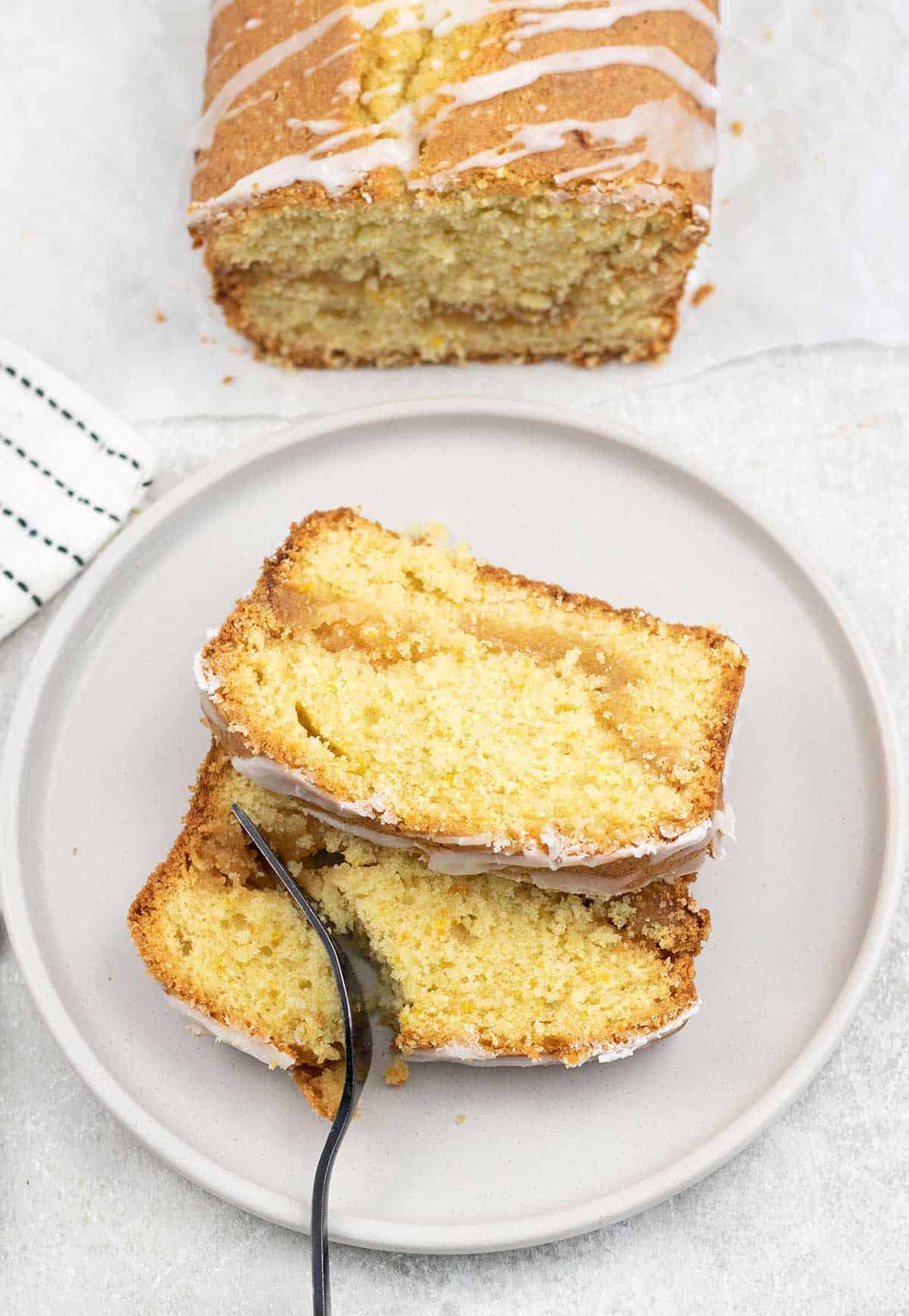 Eat a slice of the marzipan cake with fork.