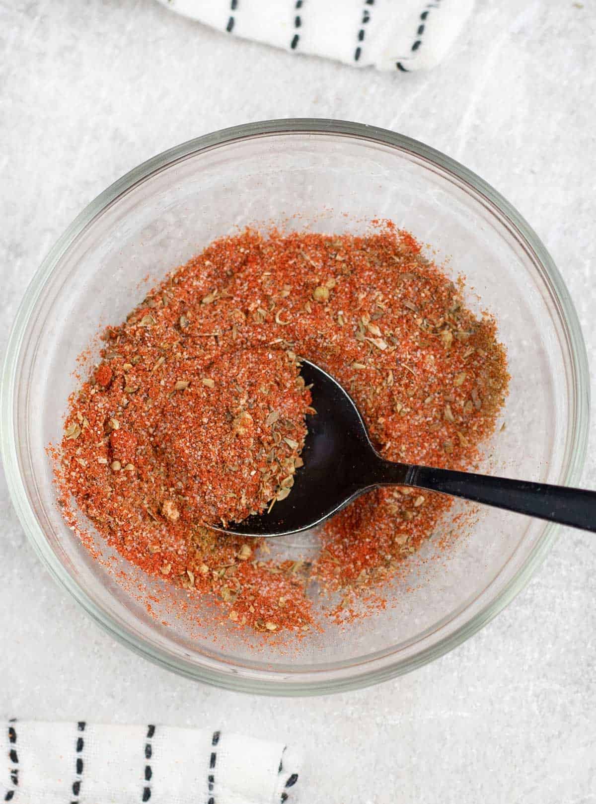 a spoonful of the Quesadilla spice mix in a small bowl.