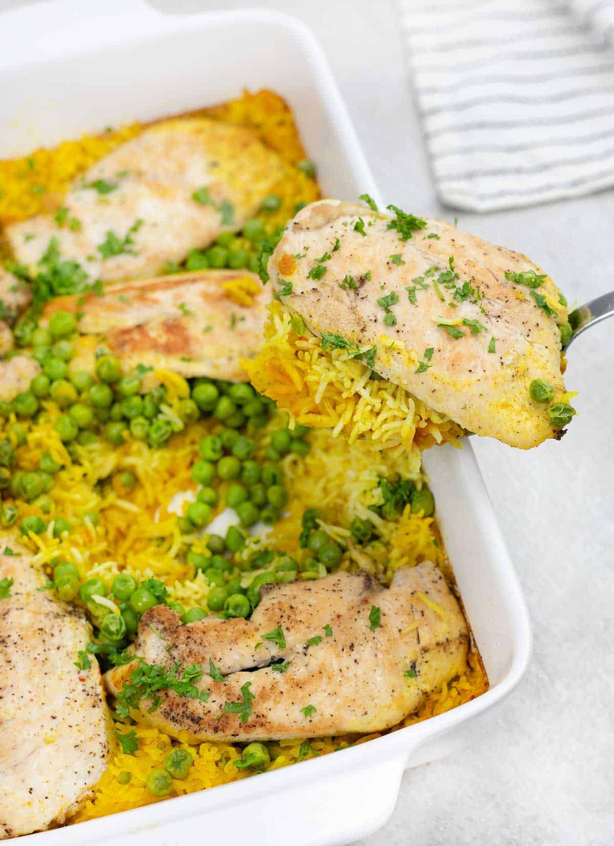 Overhead shot of a slice of chicken and some yellow rice