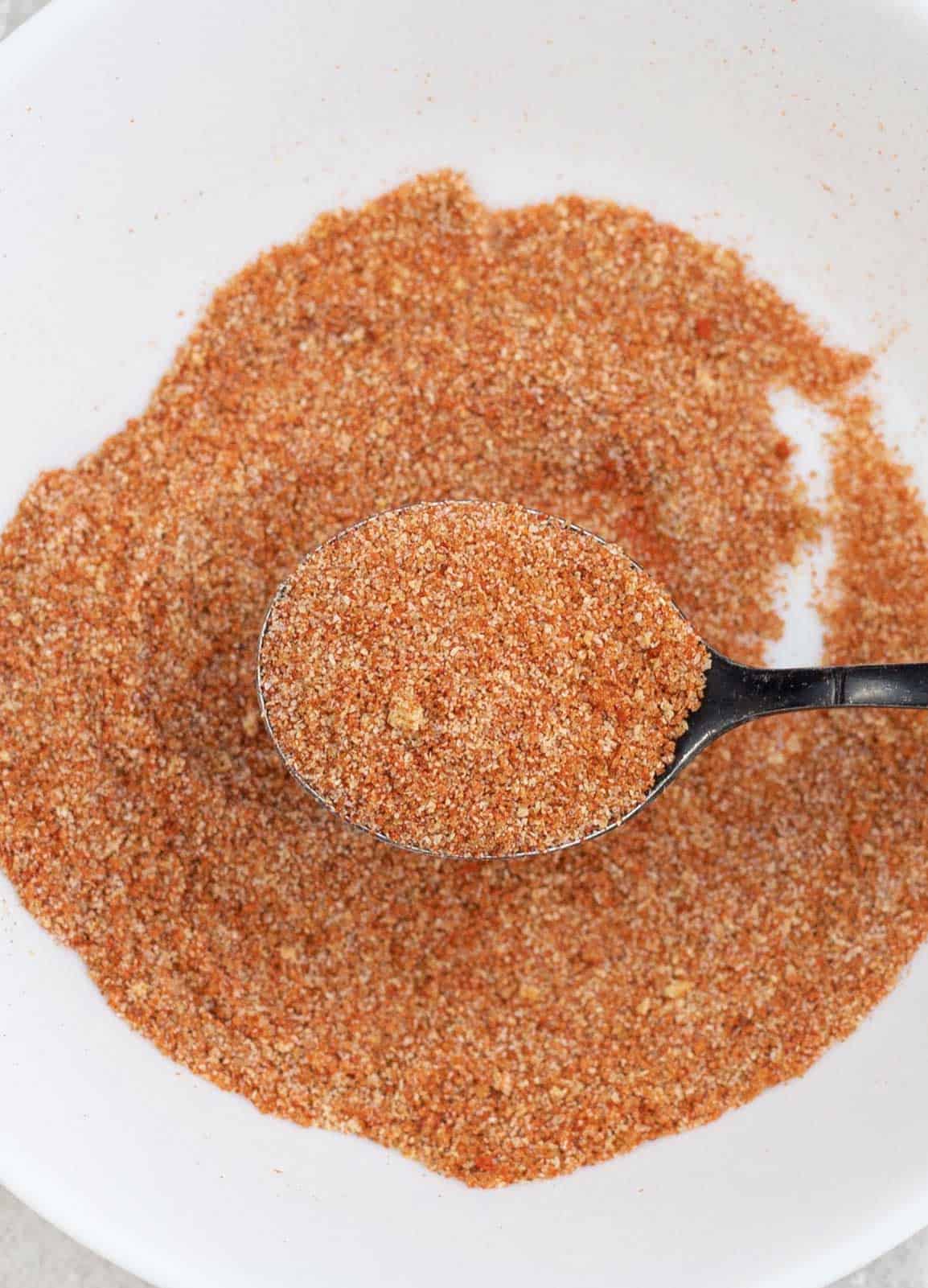 Enchilada Seasoning Mix on a spoon.