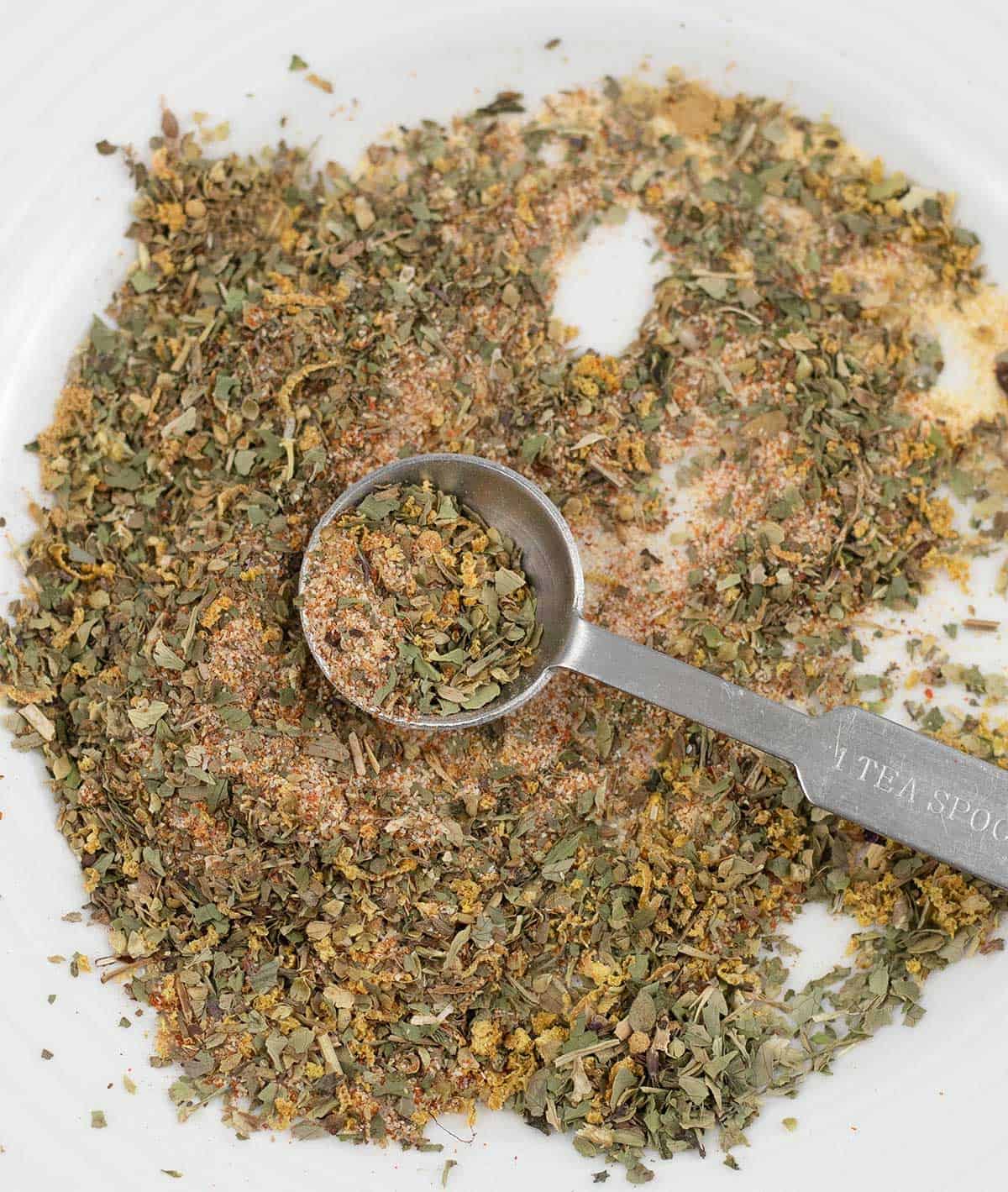 A measuring teaspoon filled with Fish Taco Seasoning.