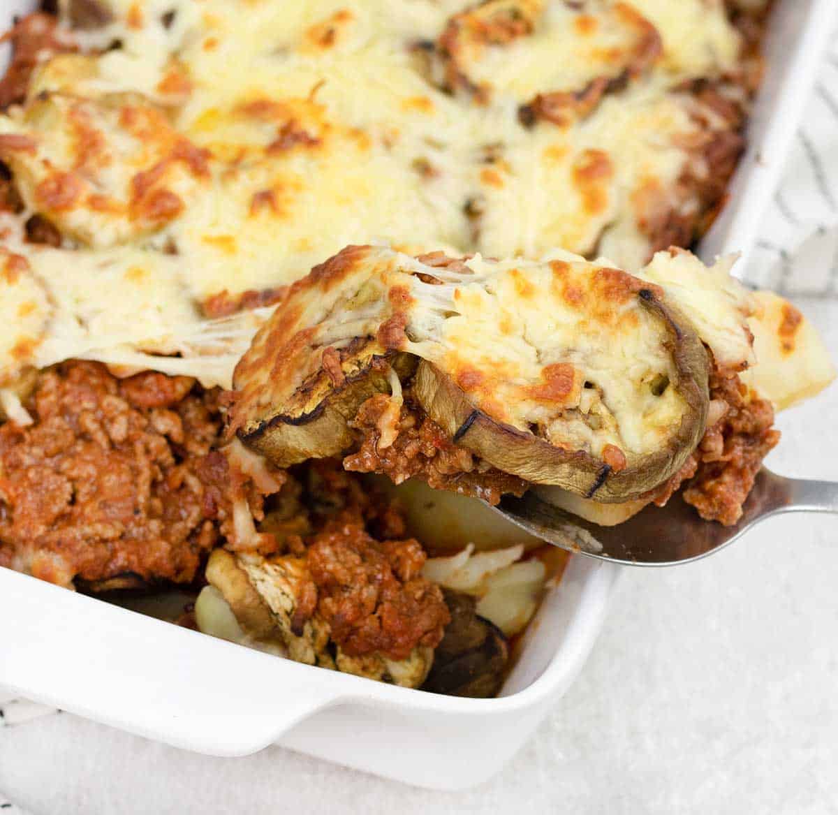 Lamb Moussaka with potatoes in a baking dish.