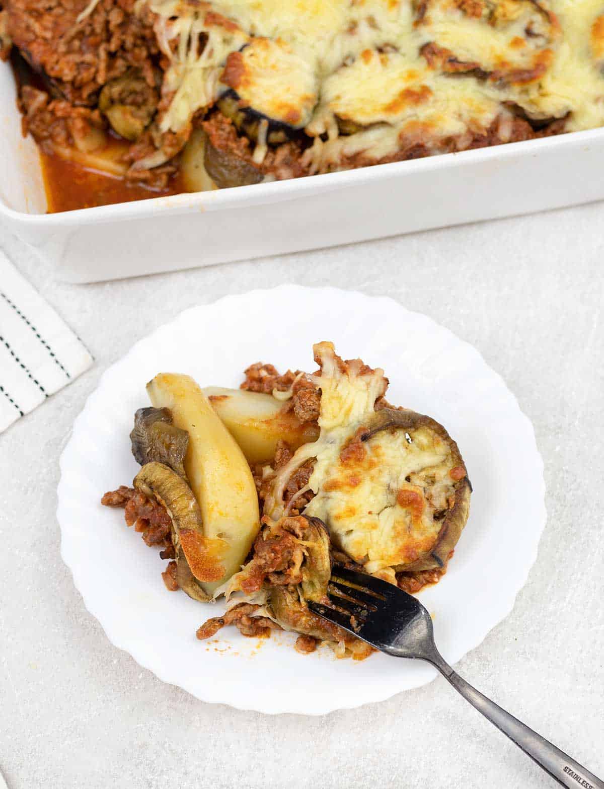 Lamb Moussaka with potatoes in a plate.