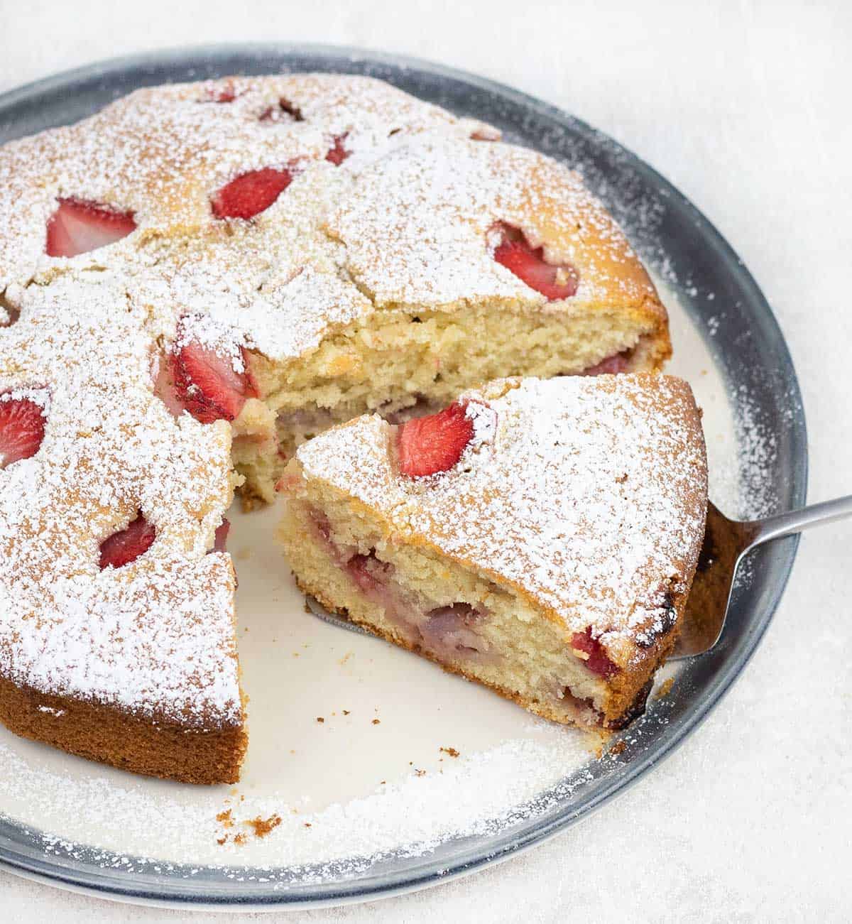 Cut a slice of French Strawberry Cake.