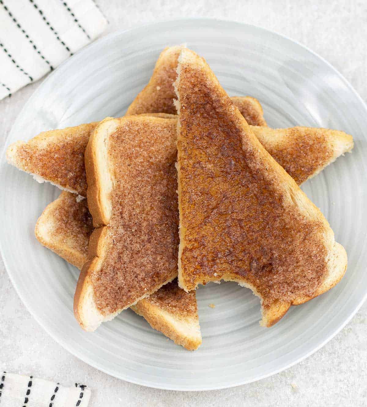 Overhead shot of a pile of Cinnamon Toast cut into halves