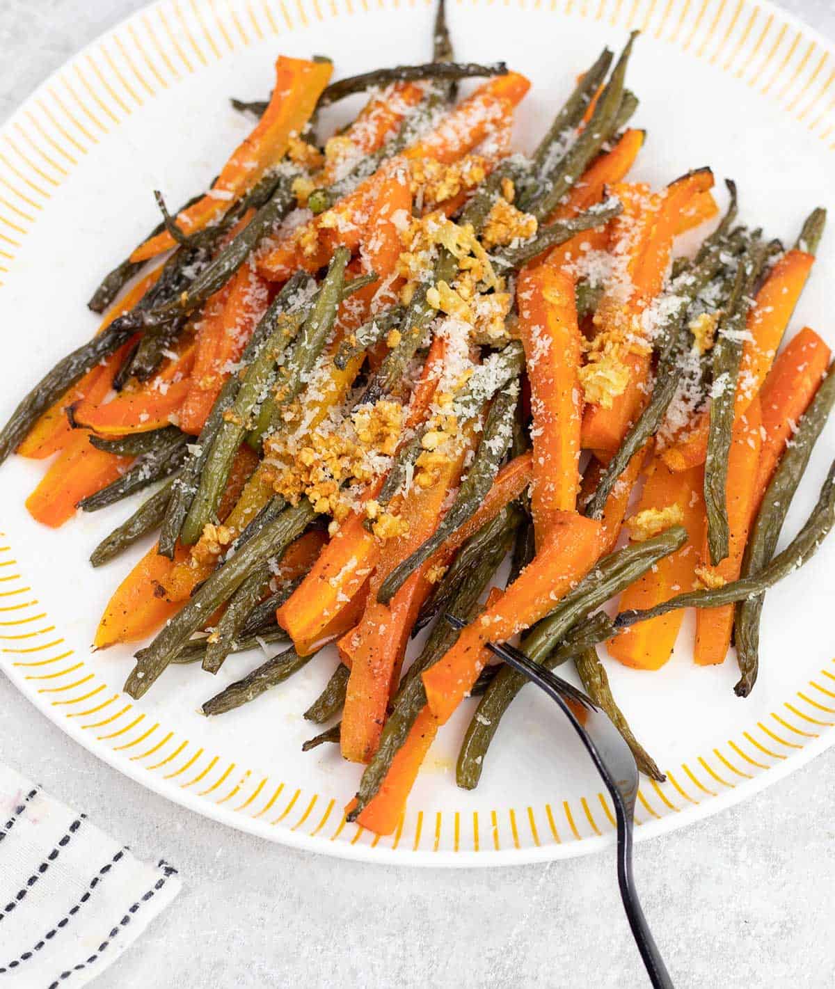 Overhead shot of a plate of  Roasted Green Beans and Carrots 